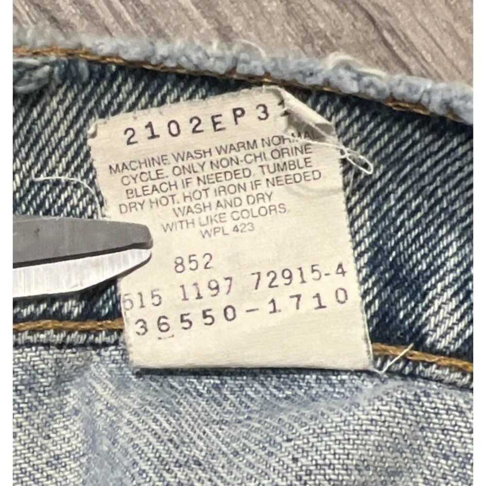 Vintage Levi's 550 Heavily Distressed Light Wash Blue Jean Shorts Size 32x10 USA